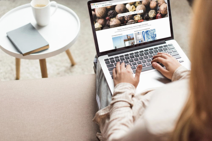 Cropped shot of a woman using Depositphotos website